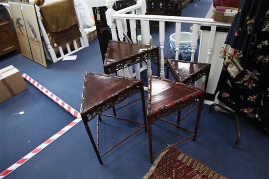 An unusual Chinese rosewood triangular shaped nest of quartetto tables, W.2ft